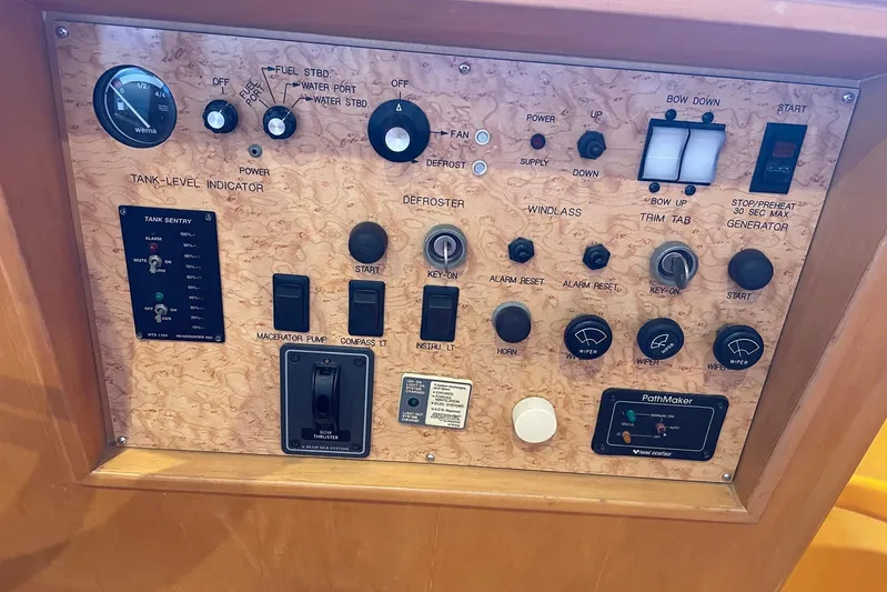 Aventis Yacht Photos Pics Control panel of a 1999 McKinna 57 Pilothouse yacht with various switches and indicators.
