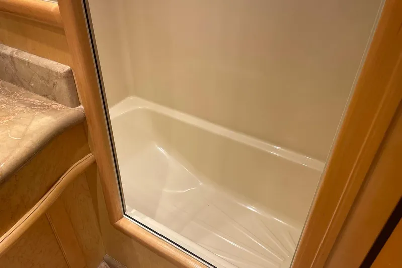 Aventis Yacht Photos Pics Shower area in 1999 McKinna 57 Pilothouse yacht with marble countertop.