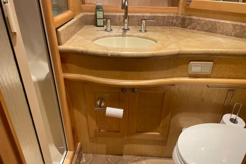 Aventis Yacht Photos Pics Luxurious bathroom in 1999 McKinna 57 Pilothouse yacht with marble countertop and modern fixtures.