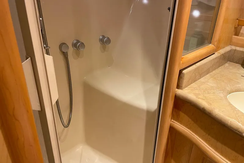 Aventis Yacht Photos Pics Shower and sink area in 1999 McKinna 57 Pilothouse yacht bathroom.
