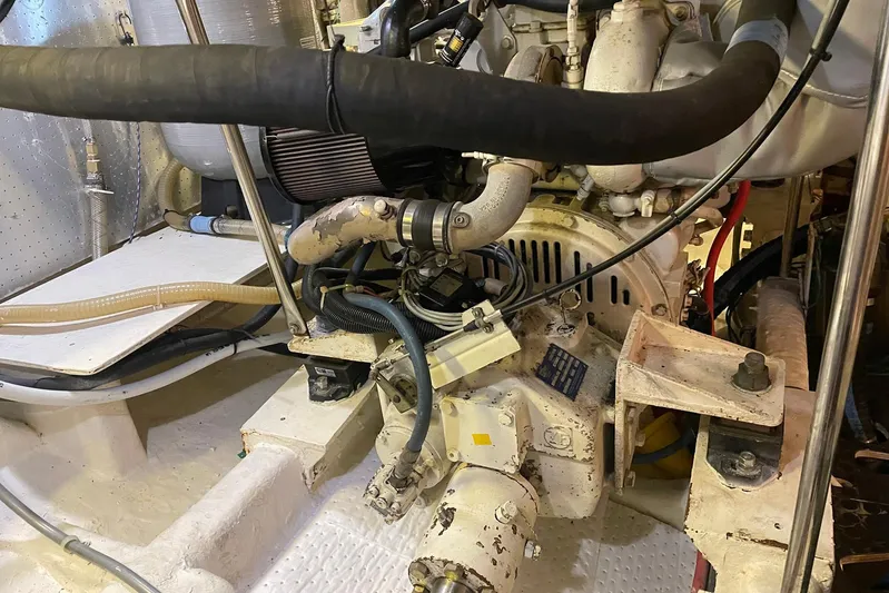 Aventis Yacht Photos Pics Engine room of a 1999 McKinna 57 Pilothouse yacht, showcasing mechanical components.