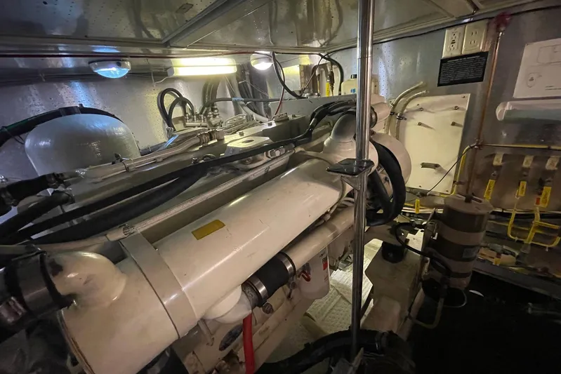 Aventis Yacht Photos Pics Engine room of a 1999 McKinna 57 Pilothouse yacht, showcasing mechanical components.