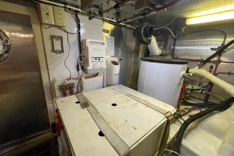 Aventis Yacht Photos Pics Engine room of 1999 McKinna 57 Pilothouse yacht with equipment and wiring.