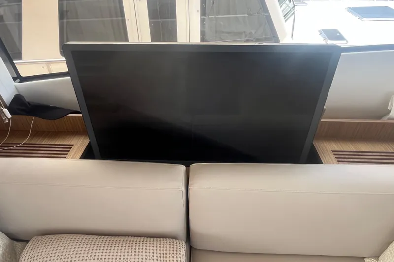  Yacht Photos Pics Luxury interior of 2020 Cayman Yachts S520 with retractable TV feature.