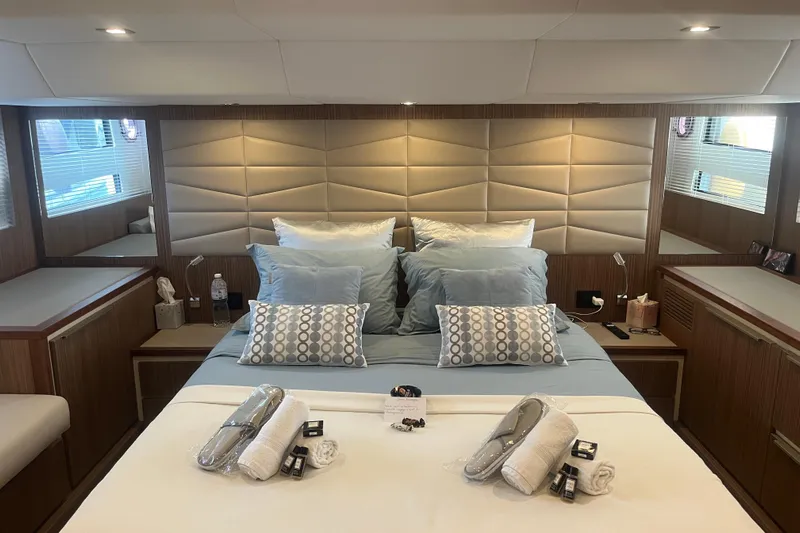  Yacht Photos Pics Luxurious bedroom interior of 2020 Cayman Yachts S520 with elegant bedding and modern design.