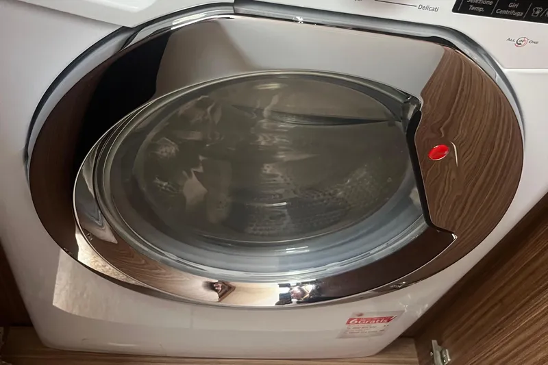  Yacht Photos Pics Front-loading washing machine with chrome accents on a Cayman Yachts S520, 2020 model.