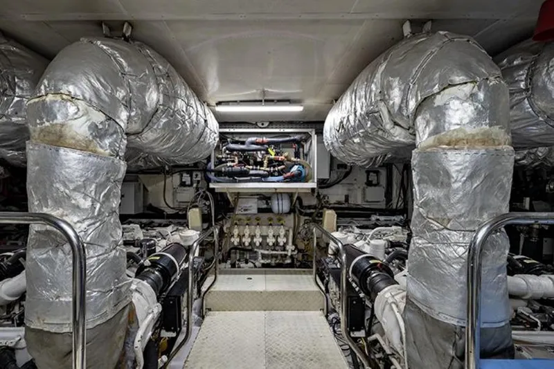 Don Ciro Yacht Photos Pics Engine room of 2002 Benetti Sail Division 105 yacht, featuring insulated pipes and machinery.