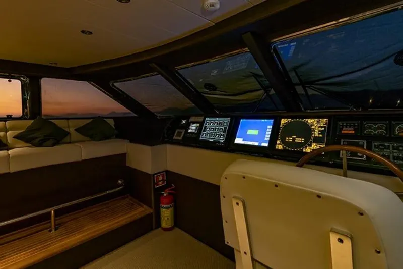 Don Ciro Yacht Photos Pics Luxurious interior of 2002 Benetti Sail Division 105 yacht with modern navigation equipment.