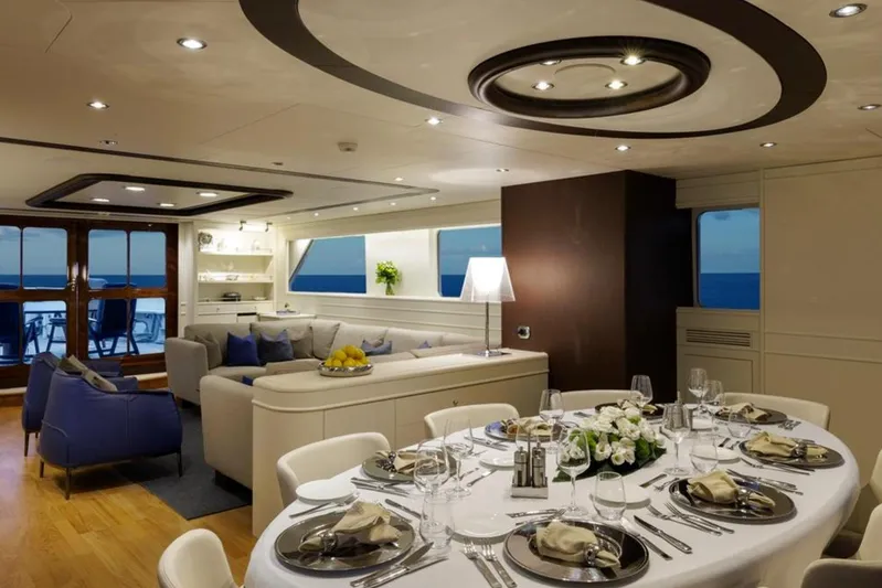Don Ciro Yacht Photos Pics Luxurious interior of 2002 Benetti Sail Division 105 yacht with elegant dining area.