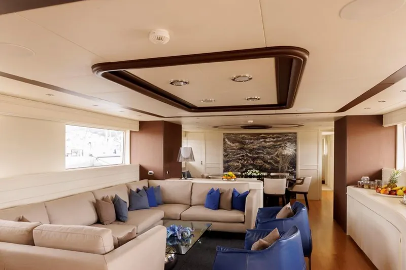 Don Ciro Yacht Photos Pics Luxurious interior of 2002 Benetti Sail Division 105 yacht with elegant seating and decor.