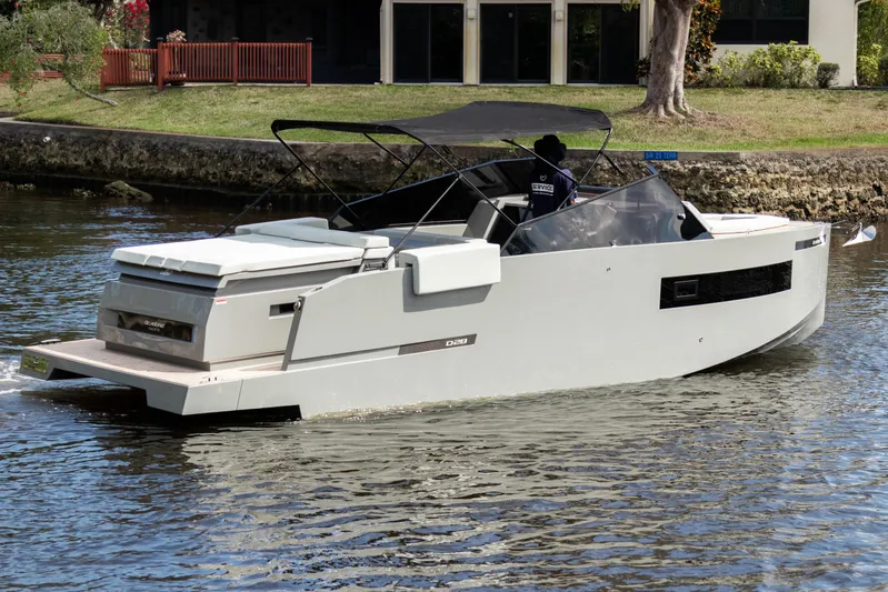  Yacht Photos Pics 2024 De Antonio Yachts D28 Cruiser on a serene waterway.