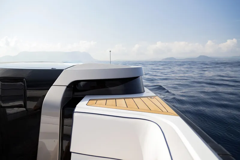  Yacht Photos Pics Futuristic 2028 Maori Limo yacht cruising on calm ocean waters.