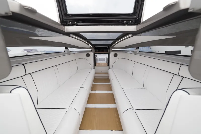  Yacht Photos Pics Luxurious interior of 2028 Maori Limo with white seating and panoramic roof.
