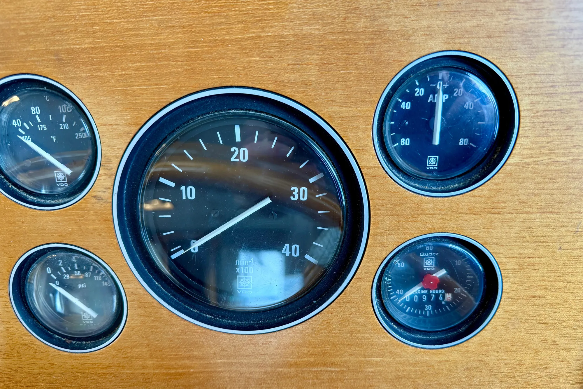 Dashboard gauges of a 1997 Grand Banks Classic boat, featuring speedometer and engine indicators.