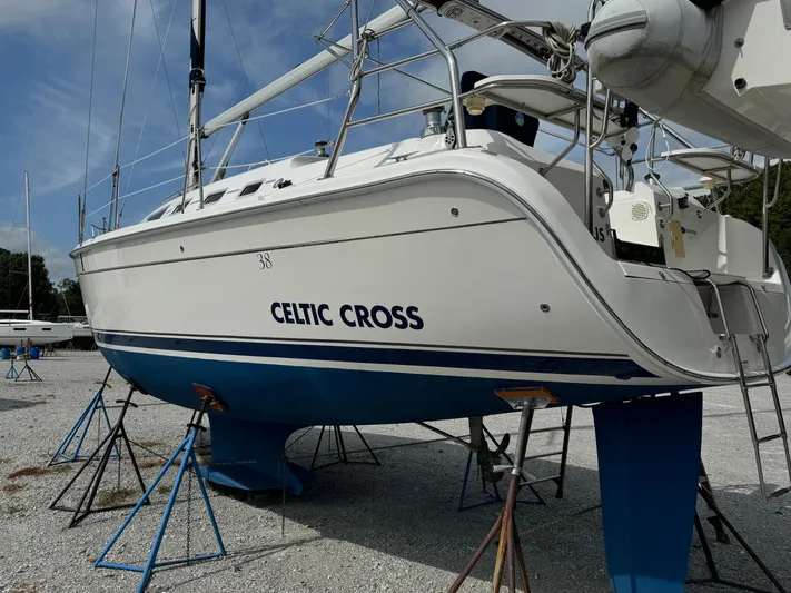 Celtic Cross Yacht Photos Pics 2008 Hunter 38 sailboat "Celtic Cross" on stands, white hull, blue bottom.