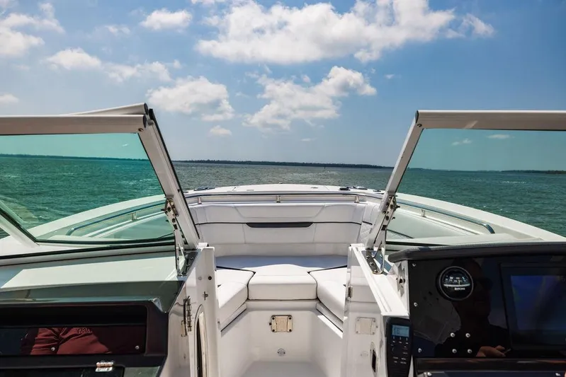  Yacht Photos Pics 2021 Blackfin 272 DC boat interior with open windshield, cruising on a sunny day.