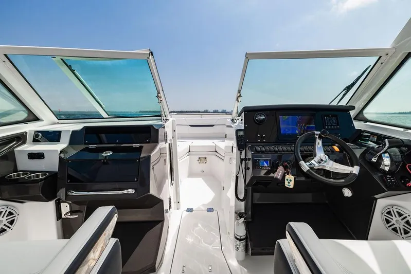  Yacht Photos Pics 2021 Blackfin 272 DC boat interior with modern dashboard and dual consoles.