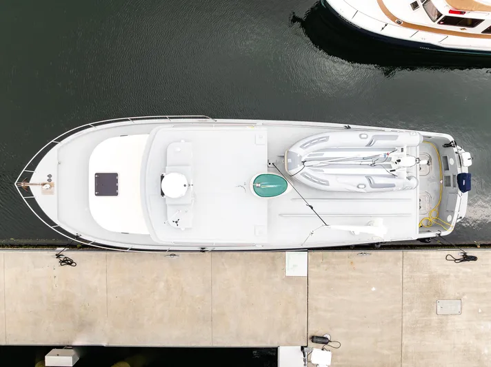 John Hunter Yacht Photos Pics Overhead view of a 2000 Nordic Tug 37 docked at a marina.