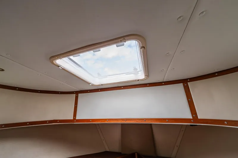 John Hunter Yacht Photos Pics Interior view of 2000 Nordic Tug 37 with skylight and wooden trim.