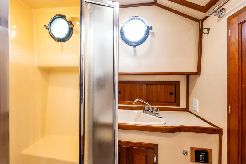 John Hunter Yacht Photos Pics Nordic Tug 37 bathroom interior with shower and sink, 2000 model.