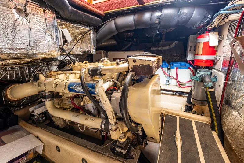 John Hunter Yacht Photos Pics Engine room of a 2000 Nordic Tug 37, featuring a diesel engine and various equipment.