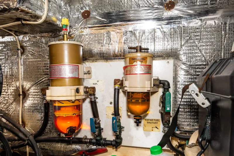 John Hunter Yacht Photos Pics Engine room of a 2000 Nordic Tug 37 with fuel filters and shutoff valves.