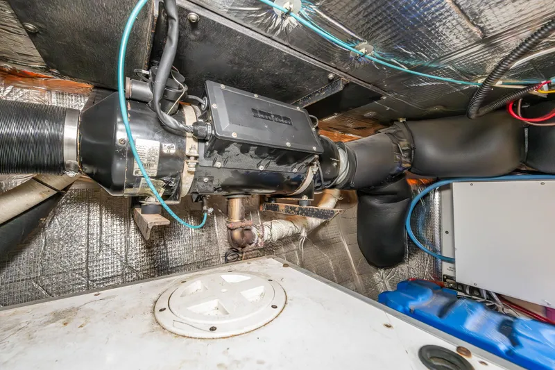 John Hunter Yacht Photos Pics Engine room of a 2000 Nordic Tug 37, showcasing mechanical components and wiring.