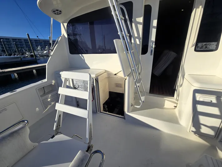 Relentless Yacht Photos Pics 2001 Ocean Yachts 43 Super Sport boat deck with ladder and open hatch.