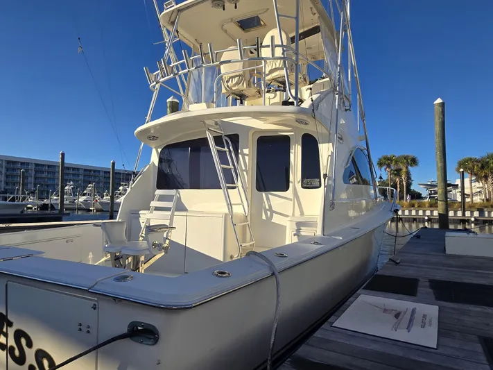 Relentless Yacht Photos Pics 2001 Ocean Yachts 43 Super Sport docked, showcasing sleek design and spacious deck.