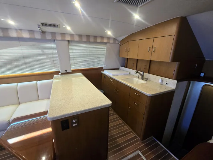 Relentless Yacht Photos Pics Interior of 2001 Ocean Yachts 43 Super Sport, featuring modern kitchen and seating area.