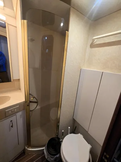 Relentless Yacht Photos Pics Bathroom interior of 2001 Ocean Yachts 43 Super Sport with shower and toilet.