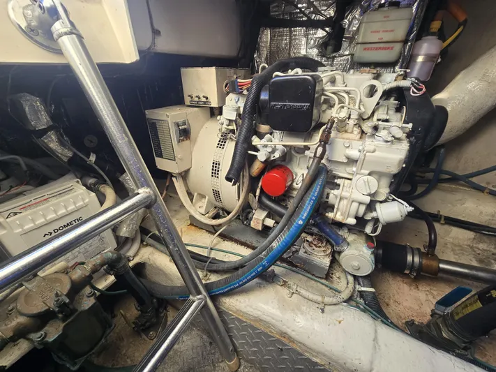 Relentless Yacht Photos Pics Engine room of a 2001 Ocean Yachts 43 Super Sport, showcasing mechanical components.