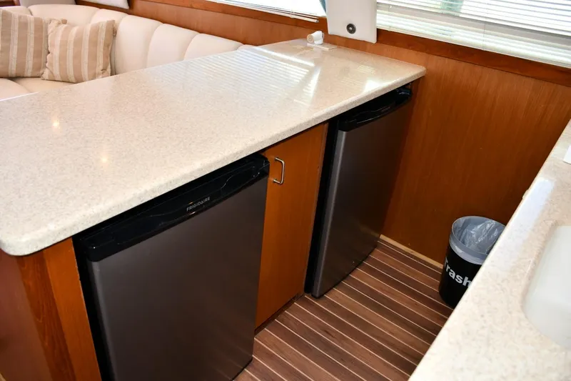 Relentless Yacht Photos Pics Interior of 2001 Ocean Yachts 43 Super Sport with dual mini-fridges and countertop.