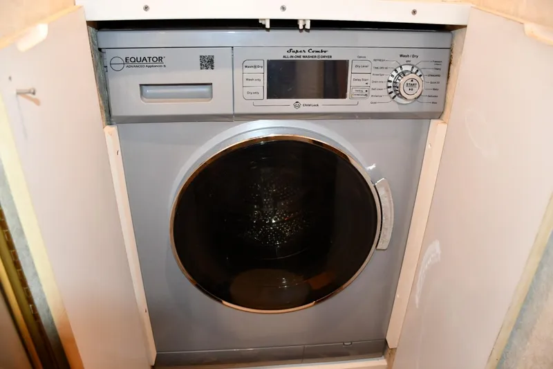 Relentless Yacht Photos Pics Compact Equator washer-dryer unit in Ocean Yachts 43 Super Sport, 2001 model.
