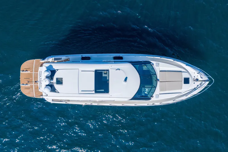 City Lights Yacht Photos Pics Aerial view of 2021 Maritimo X50 yacht cruising on blue ocean waters.