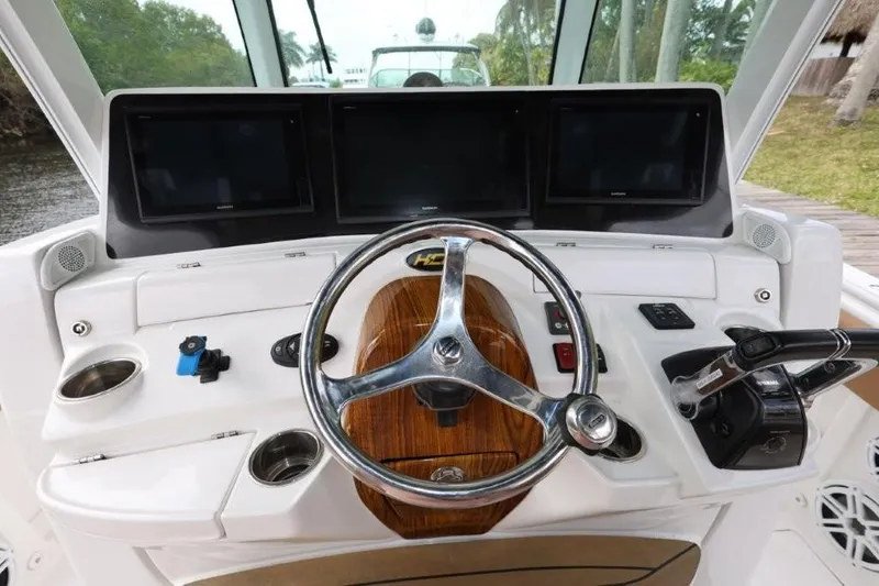 Bada Bing Yacht Photos Pics Helm of 2020 HCB 39 Speciale boat with steering wheel and control panels.