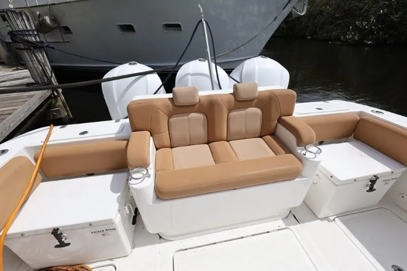 Bada Bing Yacht Photos Pics 2020 HCB 39 Speciale boat interior with tan seating and triple outboard engines.