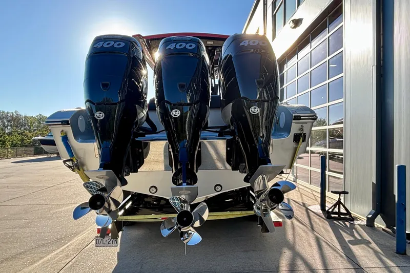  Yacht Photos Pics 2021 Fountain 38 SC boat with triple 400 horsepower engines, parked outdoors.