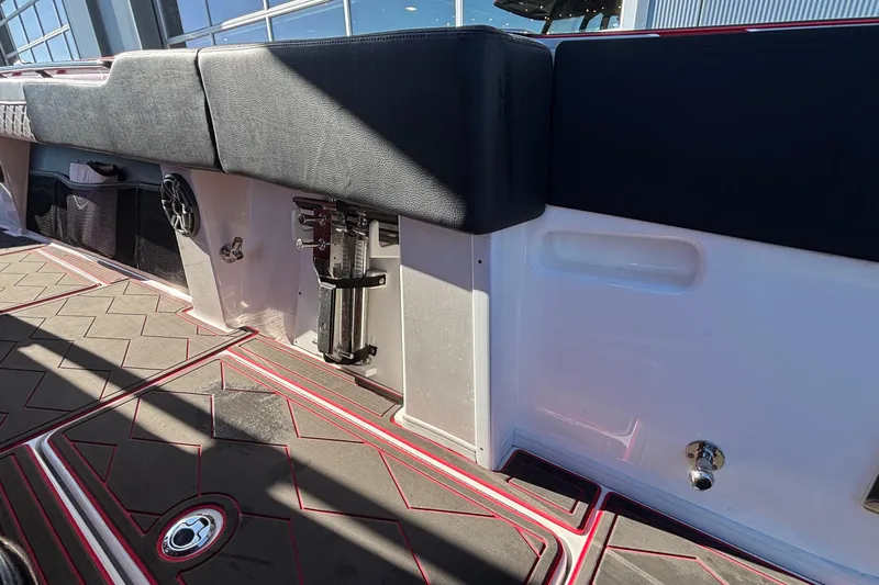  Yacht Photos Pics Interior view of 2021 Fountain 38 SC boat with cushioned seating and modern flooring.