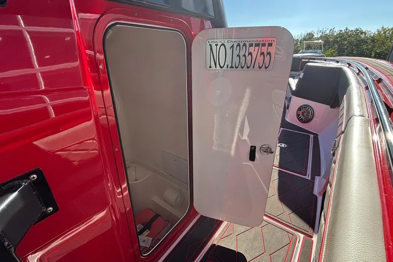  Yacht Photos Pics 2021 Fountain 38 SC boat with open storage compartment and USCG documentation number.