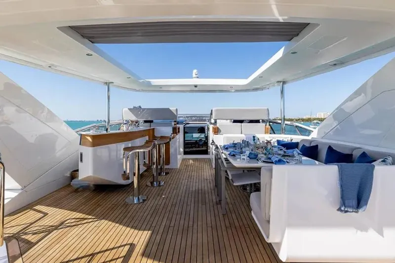  Yacht Photos Pics Luxurious deck of 2021 Azimut Grande 27 METRI yacht with dining area and bar.