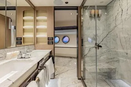 Yacht Photos Pics Luxurious bathroom on 2021 Azimut Grande 27 METRI yacht with marble finishes and modern fixtures.