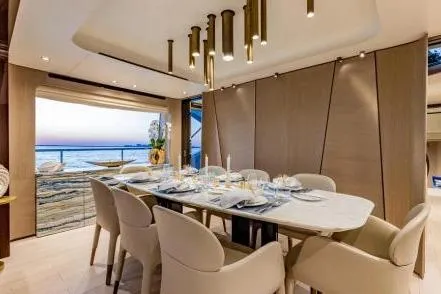 Yacht Photos Pics Luxurious dining area on 2021 Azimut Grande 27 METRI yacht with elegant decor and sea view.