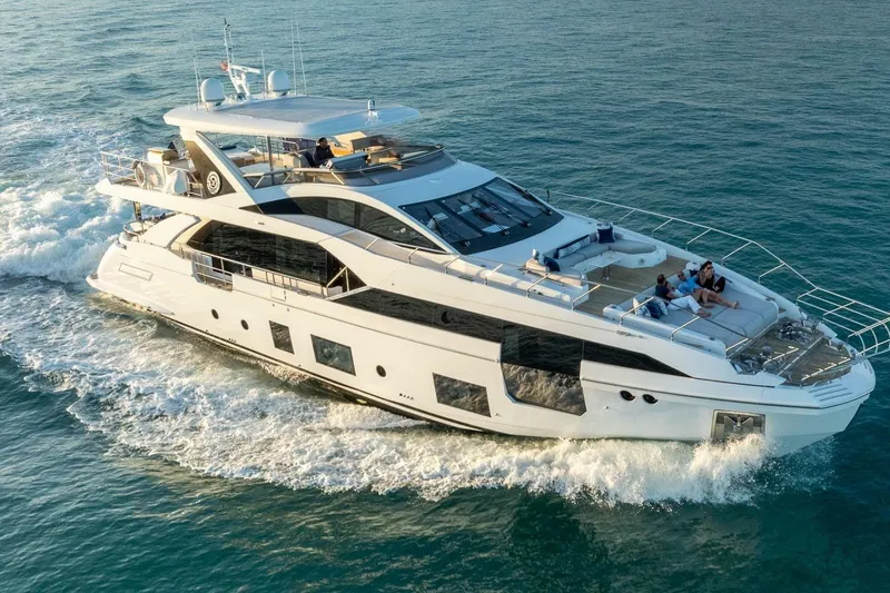 Yacht Photos Pics Luxurious 2021 Azimut Grande 27 METRI yacht cruising on open water.