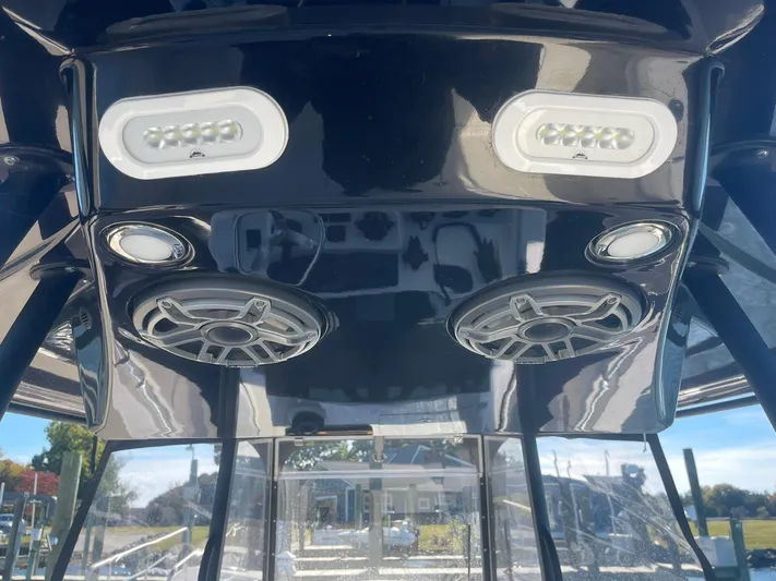  Yacht Photos Pics 2023 Cobia 320 CC boat speakers and LED lights on black console.