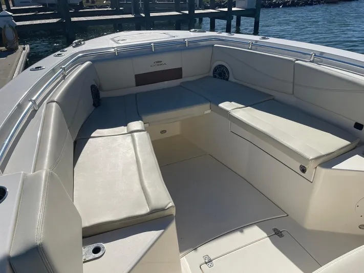  Yacht Photos Pics 2023 Cobia 320 CC boat interior with spacious seating and sleek design.