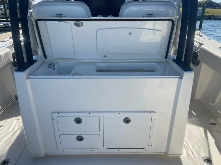  Yacht Photos Pics 2023 Cobia 320 CC boat interior with storage compartments and sink.