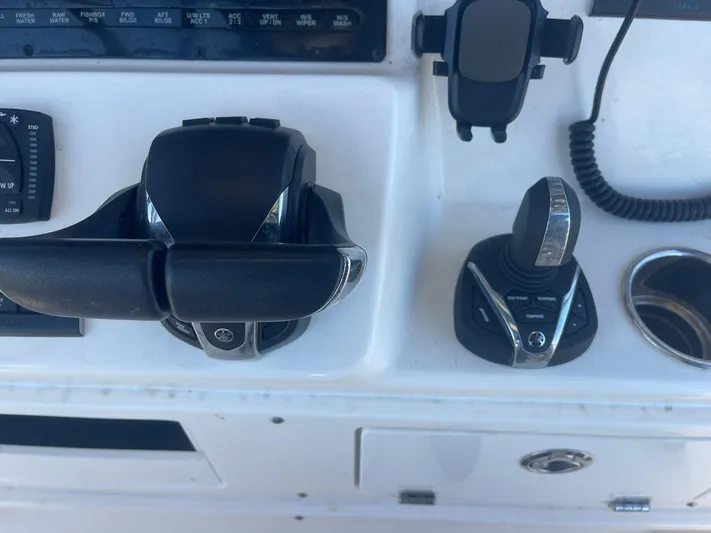  Yacht Photos Pics Cobia 320 CC 2023 boat controls and dashboard with throttle and joystick.