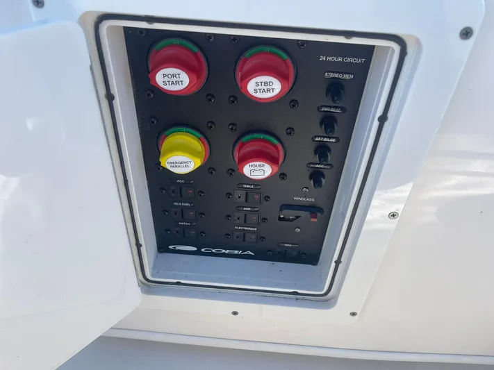  Yacht Photos Pics Control panel of 2023 Cobia 320 CC boat with start buttons and switches.
