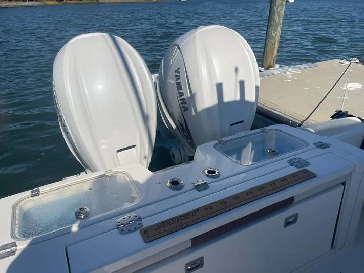  Yacht Photos Pics 2023 Cobia 320 CC boat with dual Yamaha outboard engines at dock.